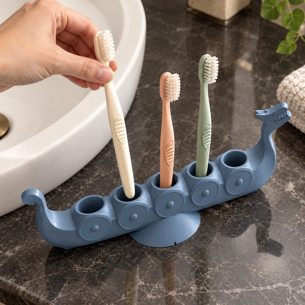 Illustrative bathroom view of the toothbrush arrangement in the Viking ship holder from another angle