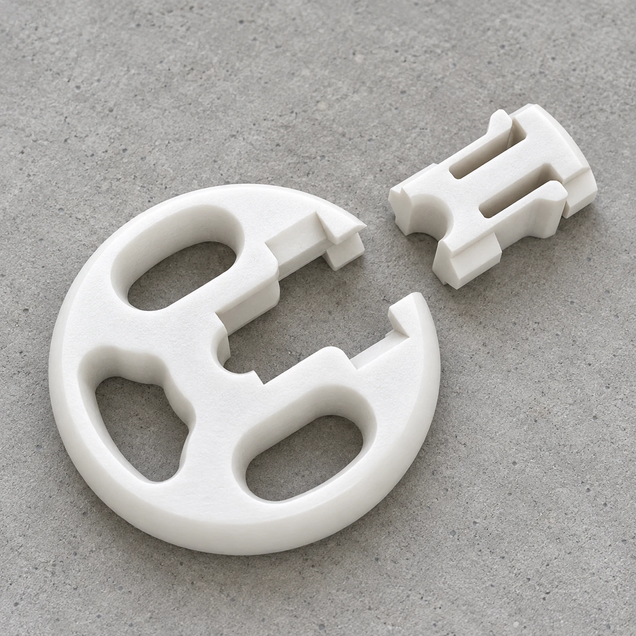 Photorealistic illustrative view of the open 100 mm roller and its separate closure on a flat grey surface